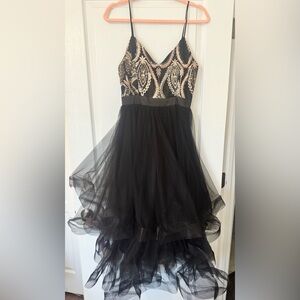 Elegant Black Dress with beaded detail at the top and tulle bottom.